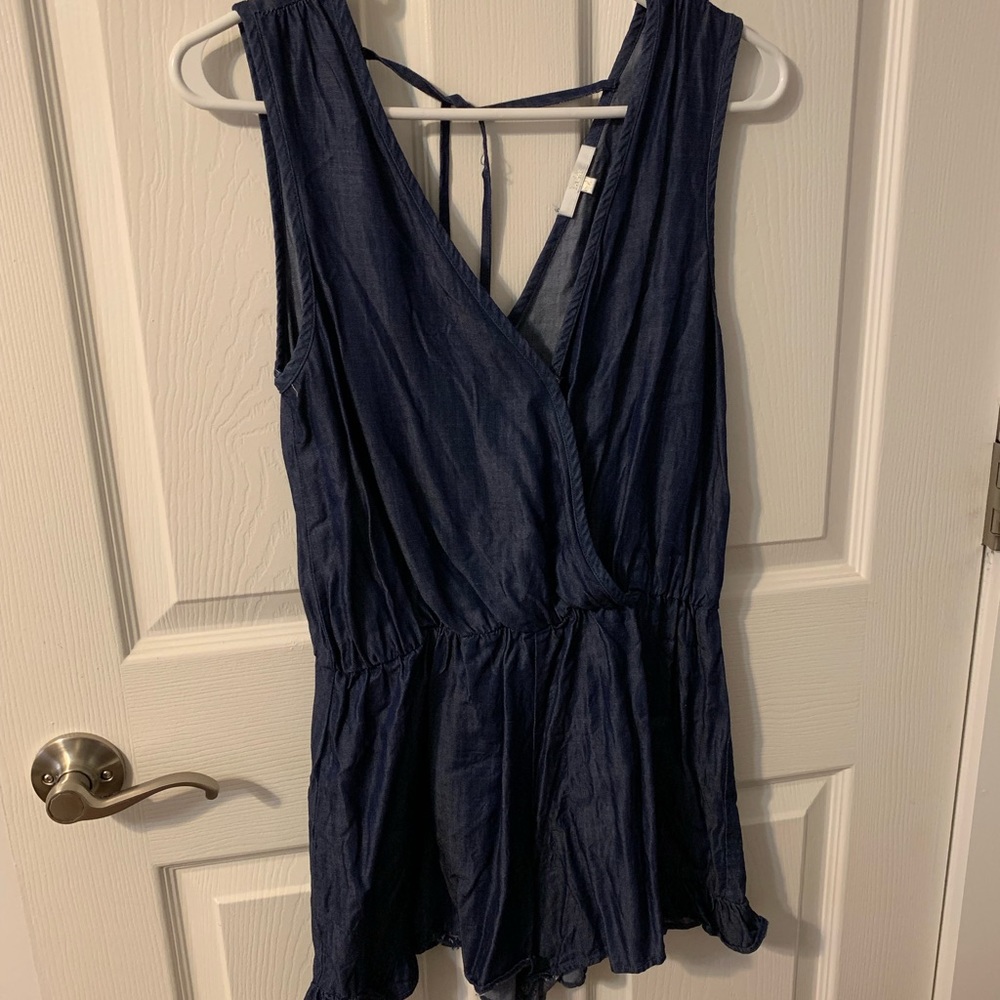 Chambray romper. V-neck with tie detail on back.